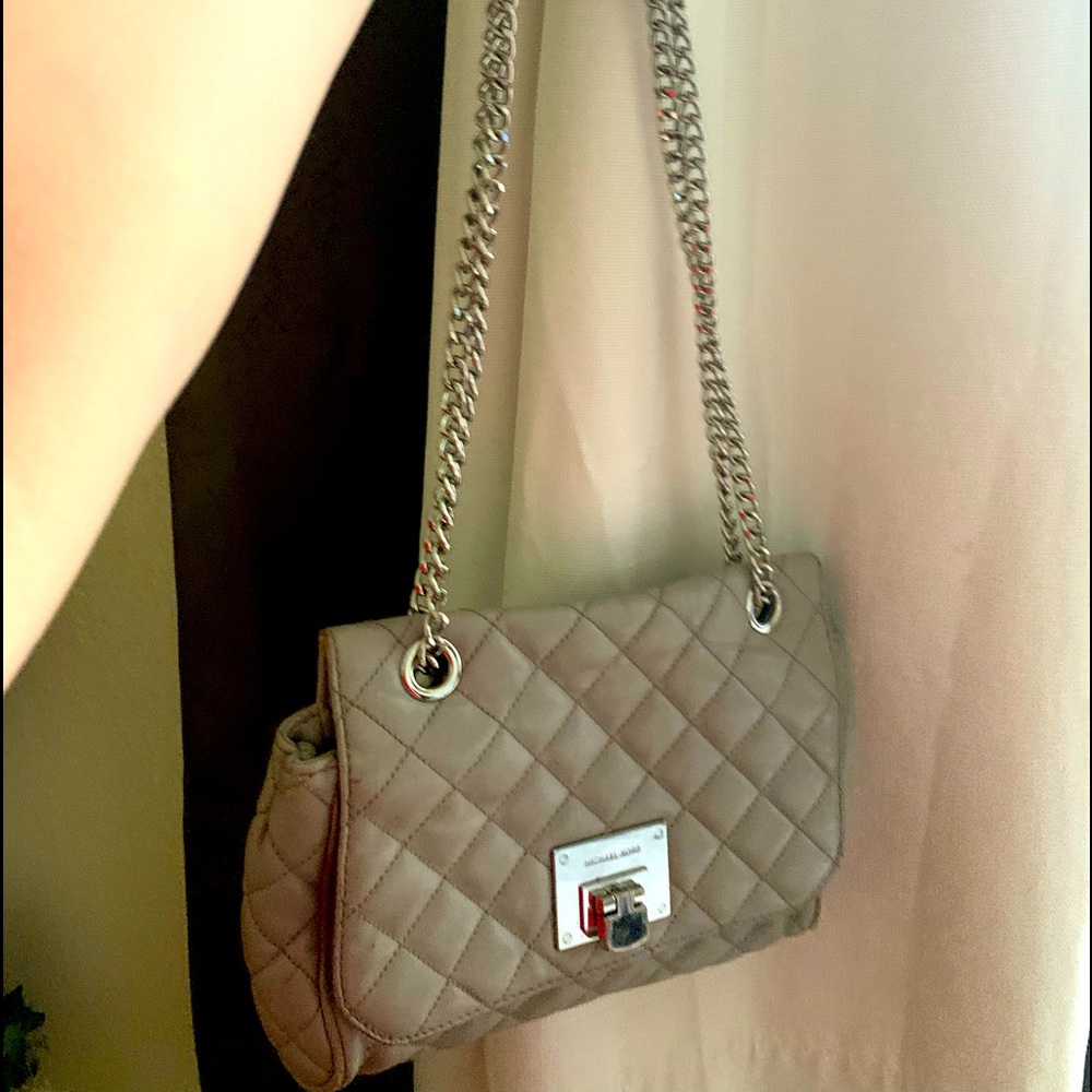 Michael Kors, very gently used you can use around body or single shoulder wear.